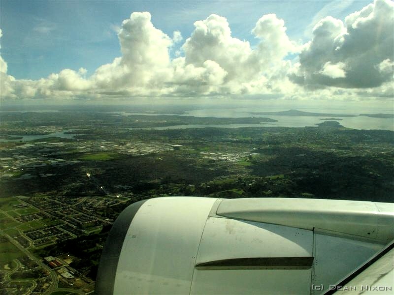 DSC05782 (Medium)_hf 19 April 2006<br>
Streaming sunlight, brilliant whites, blues and greens announce our descent over Auckland. The old familiar landmarks are still there, but this time the city seems so much smaller. After one or two weird questions from the immigration officials, and then through to find my brother and his son waiting for me...and we're off to find coffee! 