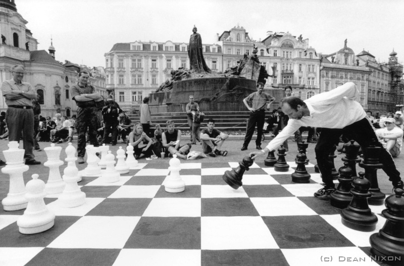 2002.06 Prague Chess_hf <div align=left>June 2002<br>Hi Bob et al, <br>Continuing from last month with the question "Why am I here and what am I doing?"...been here nearly 4 years now, & contrary to popular belief, not really nearly drowning in fine amber fluids (learning by drinking?) no, of course its an evolving process of "immersing myself in another culture" (ja...clichs!) - being exposed to what seems to be another way of seeing: not only referring to photography, or even art in general, but also the world and ones place in it. <br>Here, questions and questioning oneself are essentially unavoidable (perhaps more so than at "home" - for me anyway), and no less so than when I first arrived. And no chance to express or attempt to answer them all on a postcard!...its endless, but it keeps me going. <br>So, all I can do is try to share some of this experience, activity, agony, and progress, with an often seemingly random image & a bit of text - ja, frequently obscured by, or peppered with, trite observations, repetition, self-deprecation... <br>But in doing so, I also expose myself, and right now this is (still) the place for me to do it in/from - or Beautiful Prague (see pic), but Ive said that before too! <br>Still...going, <br>Dean <br>