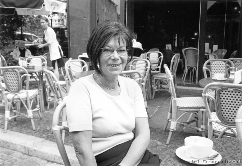 2003.07 Gisela Kallenbach_hf <div align=left>July 2003<br>Hi folks,<br>Id like to introduce a very good friend of mine, Gisela Kallenbach - here she is enjoying the sun at one of her favourite cafes in Leipzig after returning home from three rewarding (& sometimes frustrating) years as UN administrator in Pec, Kosovo. Shes glad its over, but shes already looking forward to her next assignment in...who knows, maybe even Baghdad!<br>Gisela brought her three children up more or less single handedly while studying biochemistry at nights and weekends in the days of the GDR(the usual state assistance was denied cos she refused to become a party member) and eventually joined underground political movements, the public prayer meetings and demonstrations which led to the ousting of the old regime. She then played a pivotal role in the formation of the new style city administration, serving them well until the call from the UN. She was recently awarded the highest possible civilian honour from the government: the "Verdienstkreuz am Bande des Verdienstordens der Bundesrepublik Deutschland".<br>Despite her demanding schedule, she always manages to find time to meet me for a coffee   to check on my progress and enquire after my dear little daughter who just turned one a few days ago...<br>Ok, Gisela: Two portfolios are currently in the hands of the Culture Dept., and David Howard (NZ poet) is writing very special texts for the Canal series..., and yes, Amy is doing very well (and quite delighted with her Buzzy Bee from the grandparents in Gizzie).<br>Cheers from boring old Dortmund (where Im sharing a flat with a photography student for a few weeks)<br>Dean<br>